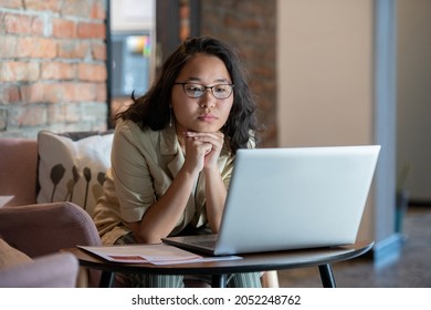 Young Businesswoman Watching Online Video Or Communicating With Someone In Front Of Laptop