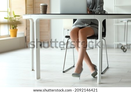 Young businesswoman working with laptop in office 商業照片 © 