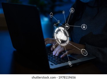 Young Businesswoman Working On His Laptop In The Office, Select The Icon Cloud On The Virtual Display.Concept Digital Technology And Cloud Technology