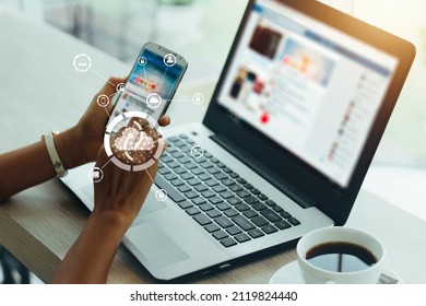 Young businesswoman working on his smartphone and laptop in the office, select the icon cloud on the virtual display.Concept digital technology and cloud technology.vintage color tones