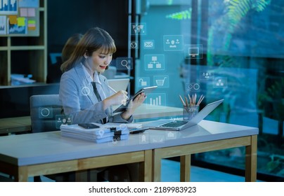 Young Businesswoman Working On Tablet And Laptop Computer With Digital Finance Marketing Chart And Future Technology Innovation And Digital Transformation Concept.