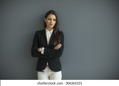 Young Bussiness Woman By The Wall