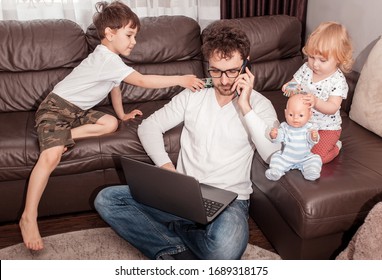 Young busy father trying to work at home with his children. Self isolation. Stay home concept. Freelancer. - Shutterstock ID 1689318175