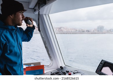 Young captain man sailing vintage boat while working during holiday vacation - Focus on face - Powered by Shutterstock