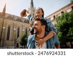 Young carefree couple piggybacking while traveling.