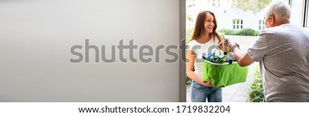 Similar – Brunette surfer woman with top and bikini kissing surfboard