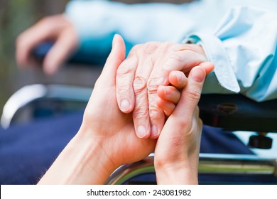 Young carer giving helping hands for the elderly woman