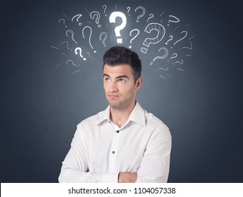Young casual businessman with white question marks above his head