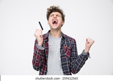 Young Casual Man Standing With Credit Card And Shouting