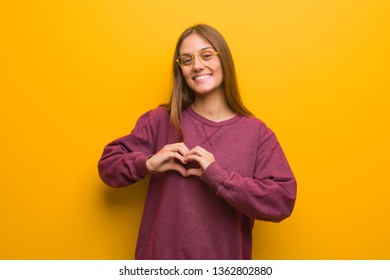Young casual woman doing a heart shape with hands - Shutterstock ID 1362802880