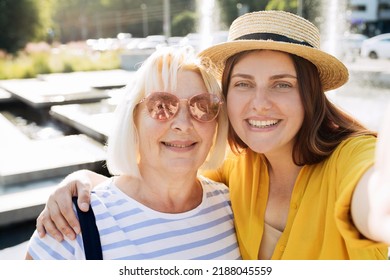 Young Caucasian Beautiful Woman In Straw Hat Gesturing Peace Sign On Urban Background, Summer Time. Number Two. Happy Redhead Girl Take A Selfie At Vacation. Solo Female Traveler.