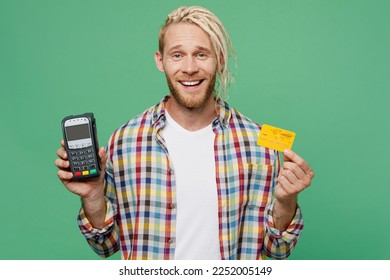 Young caucasian blond man with dreadlocks he wear casual shirt hold wireless modern bank payment terminal to process acquire credit card isolated on pastel plain light green background studio portrait - Shutterstock ID 2252005149