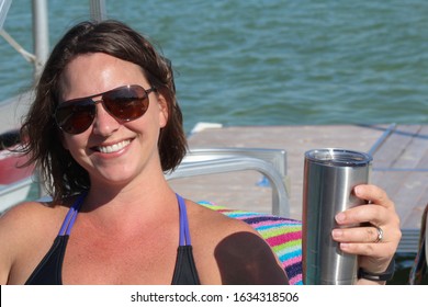 Young Caucasian Brunette With A Beautiful Smile Toasting To Vacation 