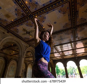 Young Caucasian Brunette Woman Performs Hip Hop Dance Wearing Athleisure Under The Minton Tiles At Bethesda Arcade