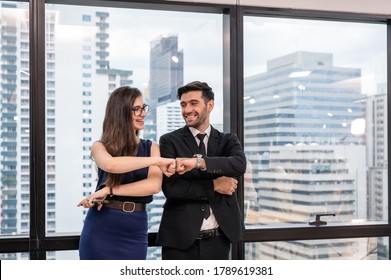 Young caucasian business partner giving fist bump and hapiness in the office at downtown. After successfully the business project together - Powered by Shutterstock