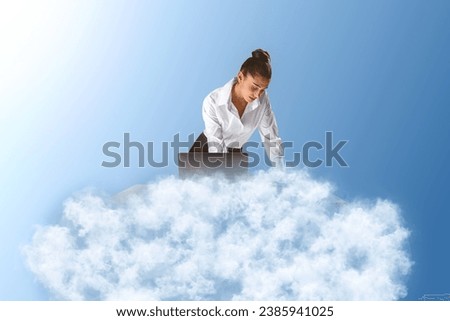 Young caucasian businesswoman using her laptop on cloud. Blue sky background. Dream big, business and strategy, forethought and vision concept