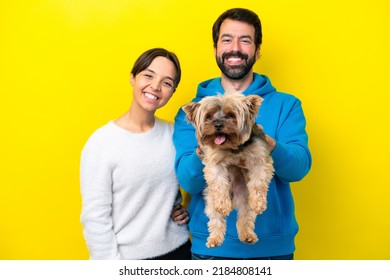 Young Caucasian Couple Holding A Dog