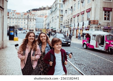 Young Caucasian family traveling and exploring the capital city of Portugal Lisbon - Powered by Shutterstock