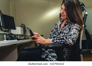 young caucasian female business office worker, sitting checking notifications and emails on the phone in break hours