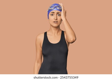 Young Caucasian female professional swimmer being shocked, she has remembered important meeting. - Powered by Shutterstock