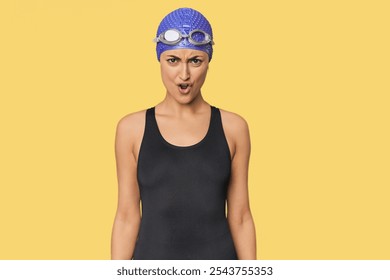 Young Caucasian female professional swimmer shouting very angry, rage concept, frustrated. - Powered by Shutterstock