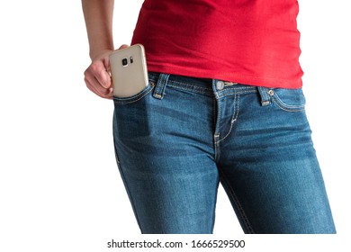 Young Caucasian female red t-shirt modeling smart phone in blue jeans pocket no face isolated on white 2020