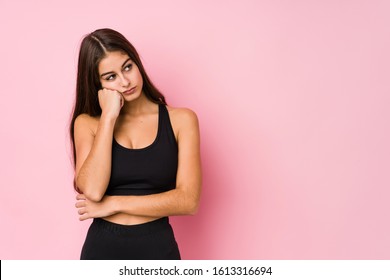 Young caucasian fitness woman doing sport isolated who feels sad and pensive, looking at copy space. - Powered by Shutterstock