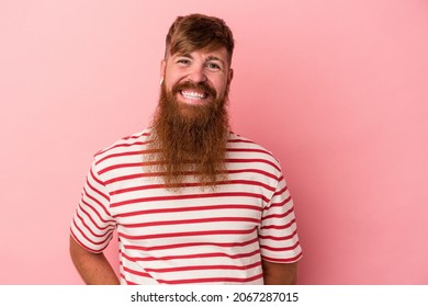 Young Caucasian Ginger Man With Long Beard Isolated On Pink Background Happy, Smiling And Cheerful.