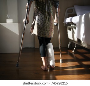 Young Caucasian Girl With Broken Leg In Plaster Cast