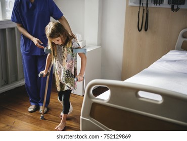 Young Caucasian Girl With Broken Leg In Plaster Cast