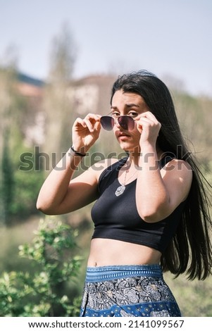 Young caucasian girl enjoying the beginning of summer with joy