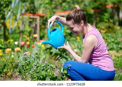 Young Caucasian Girl Handling Flowers On Stock Photo 1123975628 ...