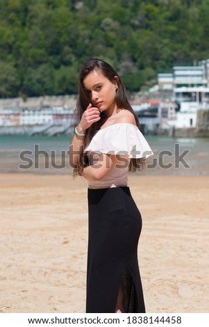 Young caucasian girl posing at La Concha bay in Donostia-San Sebastian; Basque Country.