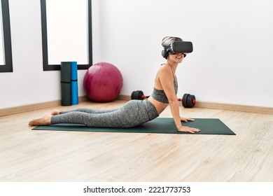 Young Caucasian Girl Using Vr Goggles Training At Sport Center.