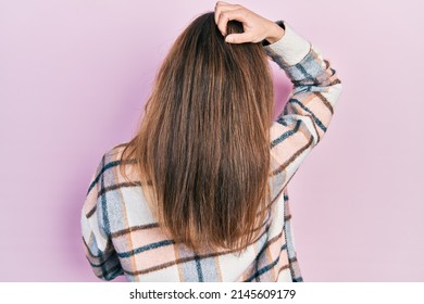 Young Caucasian Girl Wearing Casual Clothes Backwards Thinking About Doubt With Hand On Head 