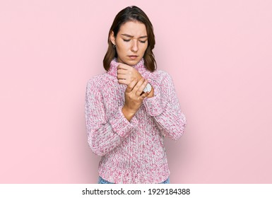 Young Caucasian Girl Wearing Wool Winter Sweater Suffering Pain On Hands And Fingers, Arthritis Inflammation 