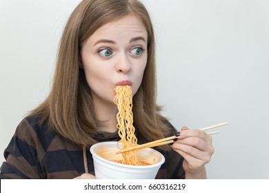 Young Caucasian Girl Woman Eating Instant Noodles Ramen With Chopsticks