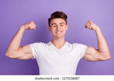 Young caucasian happy sporty fitness man 20s show biceps muscles hand isolated on bright color background studio portrait - Shutterstock ID 2175538687