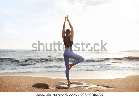 Young caucasian lady enjoy morning workout, silence, calmness and relax, breathing exercises, practicing yoga on sea beach. Sports, lifestyle and body care, weight loss outdoor, full length