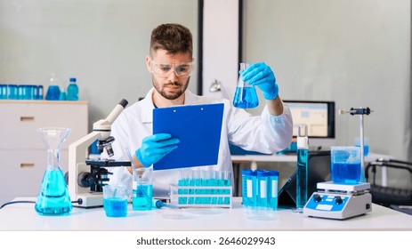 Young Caucasian male scientist works in laboratory, analyzing chemical samples with glassware and microscope. research tools, experiments, data interpretation, pharmaceutical development.