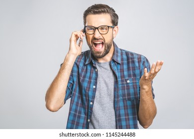 Young Caucasian Man Angry, Frustrated And Furious With His Phone, Angry With Customer Service. Isolated.