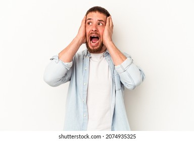 Young caucasian man with diastema isolated on white background covering ears with hands trying not to hear too loud sound. - Shutterstock ID 2074935325