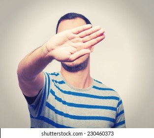 Young Caucasian Man Hiding His Face With Hand