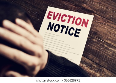 a young caucasian man with his hands in his head concerned because has just received an eviction notice - Shutterstock ID 365628971