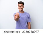 Young caucasian man isolated on white background inviting to come with hand. Happy that you came