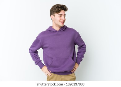 Young caucasian man isolated on white background confident keeping hands on hips. - Shutterstock ID 1820137883