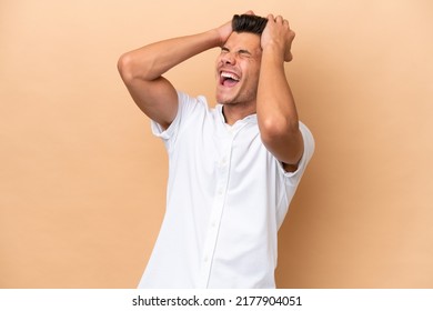 Young Caucasian Man Isolated On Beige Background Stressed Overwhelmed