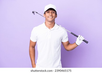 Young caucasian man isolated on purple background playing golf - Powered by Shutterstock