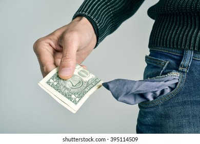 Millennial Money Images Stock Photos Vectors Shutterstock - a young caucasian man in jeans taking one us dollar out of his pocket