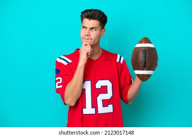 Young Caucasian man Playing rugby isolated on blue background having doubts and thinking - Powered by Shutterstock